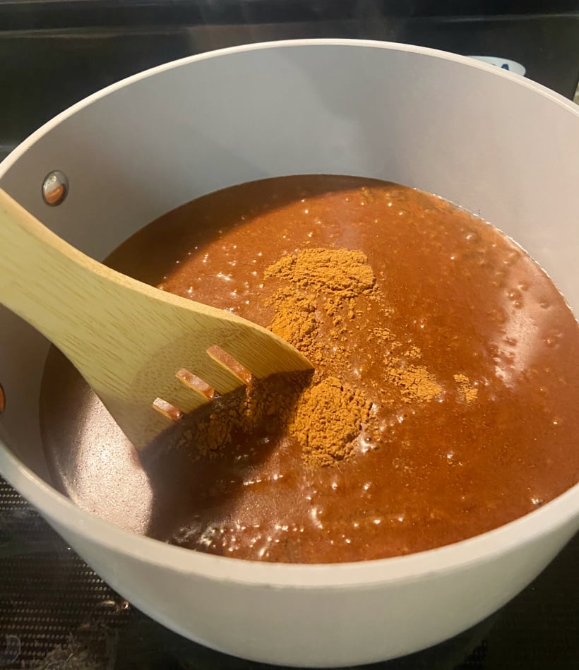 boiling a natural DIY cinnamon spray for bugs