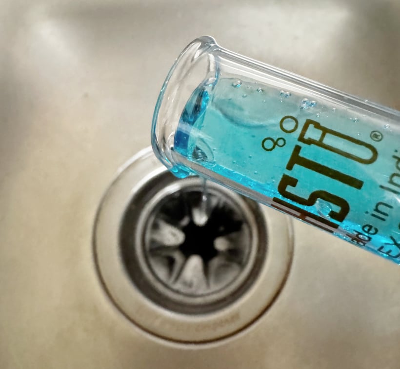 adding dish soap to drain