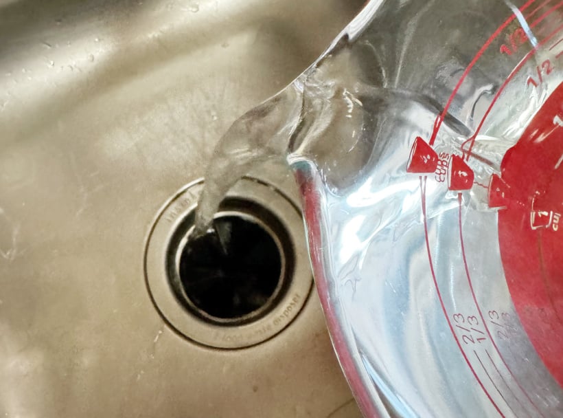adding hot water to drain